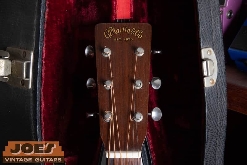 Solid C.F. Martin peghead with EST. 1833 decal on a 1950 Martin 5-18, not a slotted headstock.